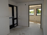 Left, Secondary entrance/exit facing car wash building; right, Executive Director's office