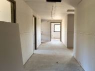 Wider hallways, additional office space (left side of hall)